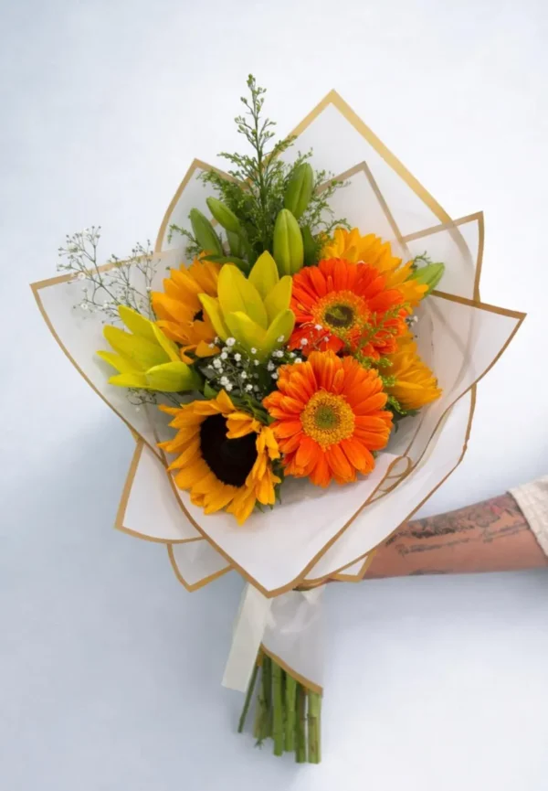 WhatsApp Image 2026-03-19 at 12.04.57 PM Ramo de lilis amarilla y girasoles